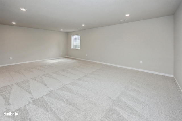 9756 Regatta Ln, Johnston, IA 50131 - empty room featuring light carpet and recessed lighting