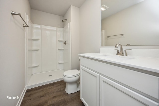 9756 Regatta Ln, Johnston, IA 50131 - bathroom featuring vanity, wood finished floors, and a shower