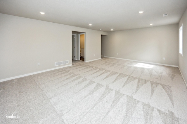 9764 Regatta Ln, Johnston, IA 50131 - empty room with light carpet and recessed lighting