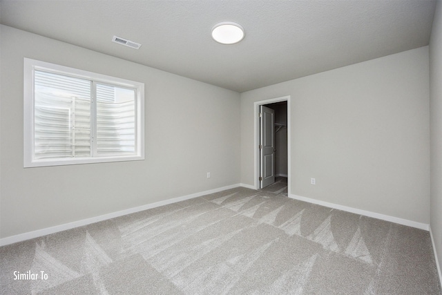 9764 Regatta Ln, Johnston, IA 50131 - unfurnished bedroom with light colored carpet and a walk in closet