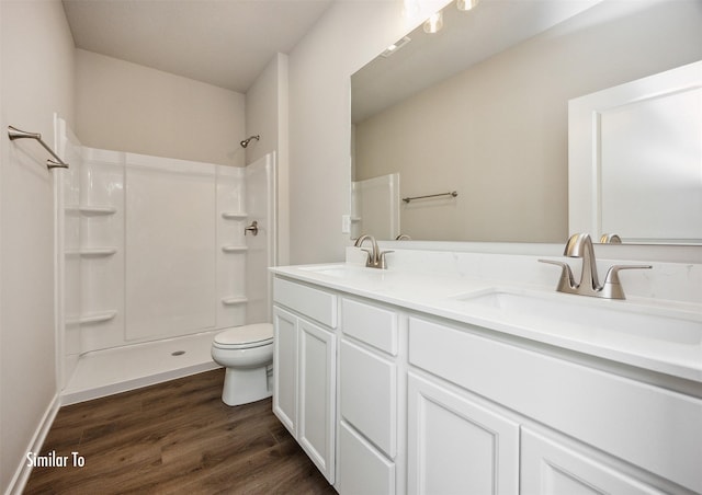 9764 Regatta Ln, Johnston, IA 50131 - full bath with double vanity, wood finished floors, and a shower