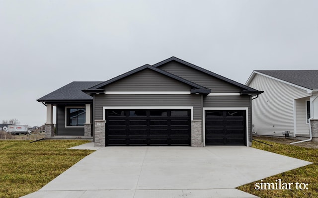 9383 Modena Ln, West Des Moines, IA 50266 - view of front of property with an attached garage, concrete driveway, and a front lawn