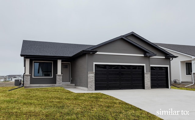 9383 Modena Ln, West Des Moines, IA 50266 - view of front of home with a garage, concrete driveway, a front lawn, roof with shingles, and stone siding