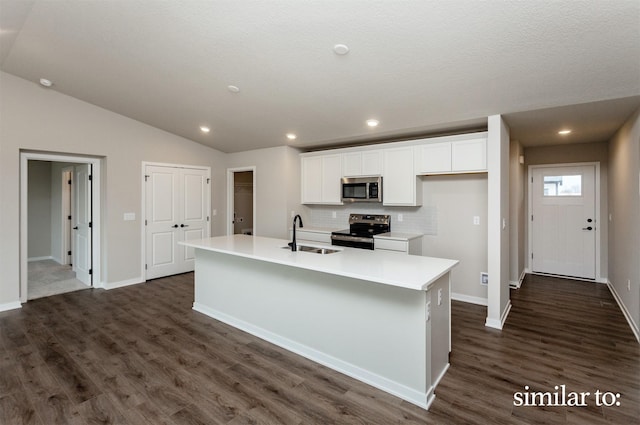 9383 Modena Ln, West Des Moines, IA 50266 - kitchen featuring stainless steel appliances, white cabinets, a kitchen island with sink, dark wood-type flooring, and decorative backsplash