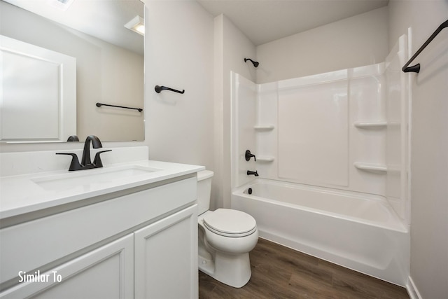 715 Linden St, Carlisle, IA 50047 - full bathroom featuring vanity, wood finished floors, and tub / shower combination
