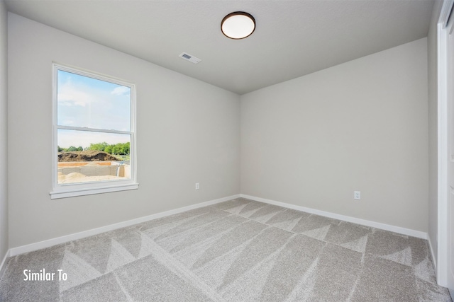 715 Linden St, Carlisle, IA 50047 - spare room with light carpet