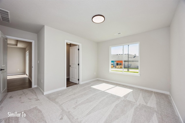 715 Linden St, Carlisle, IA 50047 - unfurnished bedroom with carpet and baseboards