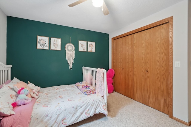 602 8th St, Malcom, IA 50157 - bedroom featuring carpet flooring, a closet, and ceiling fan