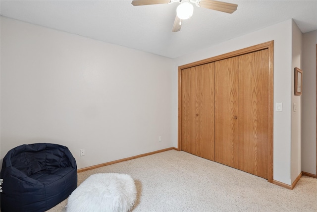 602 8th St, Malcom, IA 50157 - carpeted bedroom with a ceiling fan and a closet