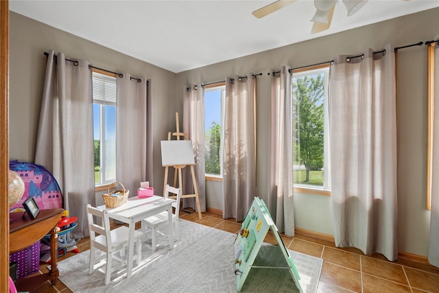 602 8th St, Malcom, IA 50157 - rec room with healthy amount of natural light, tile patterned floors, and a ceiling fan