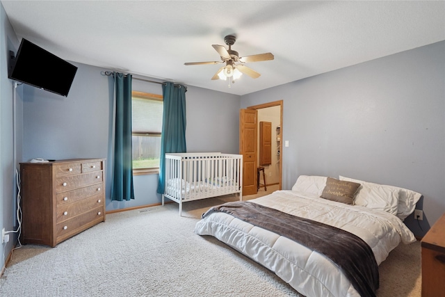 602 8th St, Malcom, IA 50157 - carpeted bedroom with ceiling fan