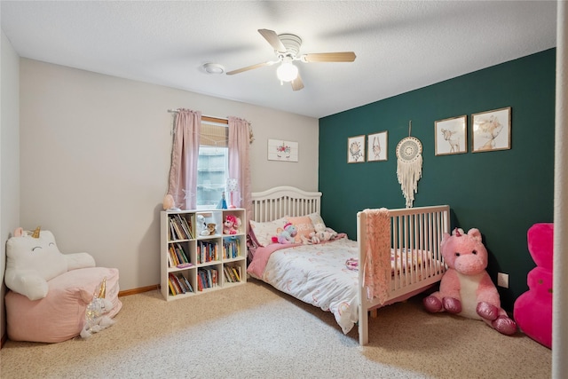 602 8th St, Malcom, IA 50157 - carpeted bedroom featuring ceiling fan