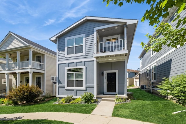 2687 NW 165th Ln, Clive, IA 50325 - view of front facade featuring a balcony and a front lawn
