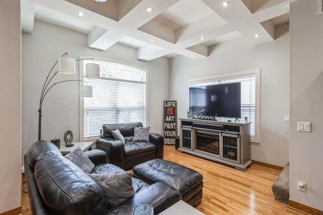 2687 NW 165th Ln, Clive, IA 50325 - living area featuring coffered ceiling, light wood-type flooring, plenty of natural light, beamed ceiling, and recessed lighting