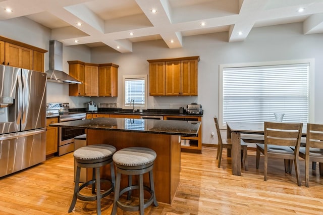 2687 NW 165th Ln, Clive, IA 50325 - kitchen featuring wall chimney exhaust hood, appliances with stainless steel finishes, coffered ceiling, brown cabinetry, and a center island