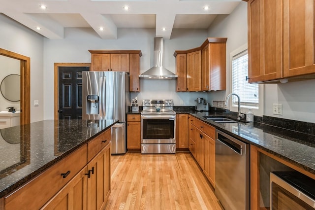 2687 NW 165th Ln, Clive, IA 50325 - kitchen with stainless steel appliances, wall chimney exhaust hood, brown cabinetry, light wood-style flooring, and recessed lighting