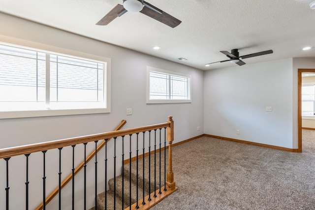 2687 NW 165th Ln, Clive, IA 50325 - unfurnished room featuring ceiling fan, carpet, recessed lighting, and a textured ceiling