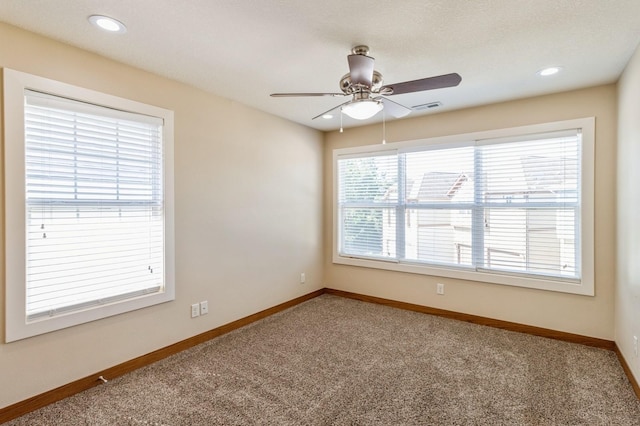 2687 NW 165th Ln, Clive, IA 50325 - carpeted spare room with a ceiling fan and recessed lighting