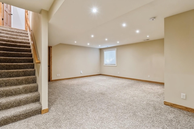 2687 NW 165th Ln, Clive, IA 50325 - below grade area featuring carpet, recessed lighting, and stairs