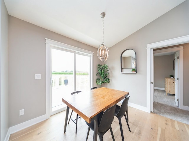 712 Mallard Pointe Dr NW, Bondurant, IA 50035 - dining space featuring light wood-style flooring and a chandelier