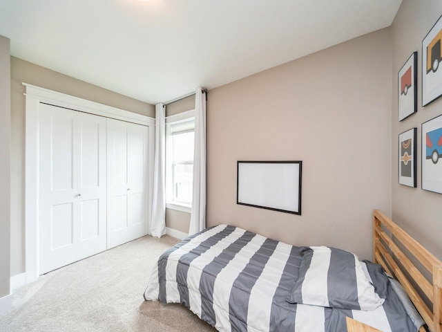 712 Mallard Pointe Dr NW, Bondurant, IA 50035 - bedroom featuring carpet flooring and a closet