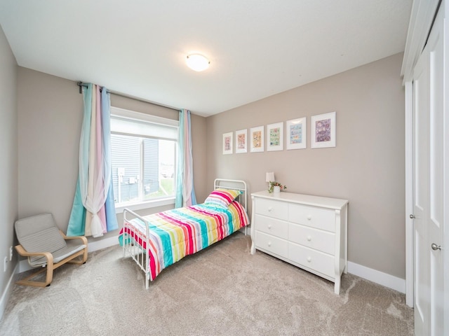 712 Mallard Pointe Dr NW, Bondurant, IA 50035 - bedroom featuring carpet flooring and a closet