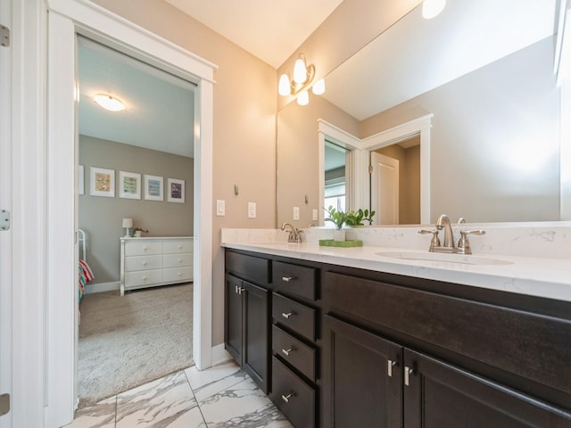 712 Mallard Pointe Dr NW, Bondurant, IA 50035 - full bathroom with double vanity and marble finish flooring