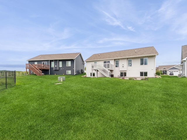 712 Mallard Pointe Dr NW, Bondurant, IA 50035 - rear view of property with stairs and a wooden deck
