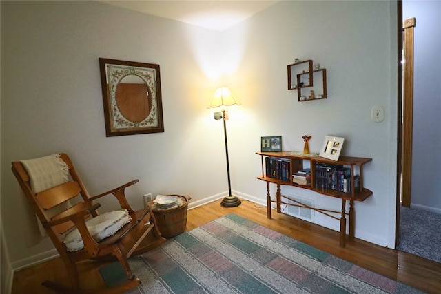 506 12th Ave NW, Altoona, IA 50009 - sitting room with wood finished floors and baseboards