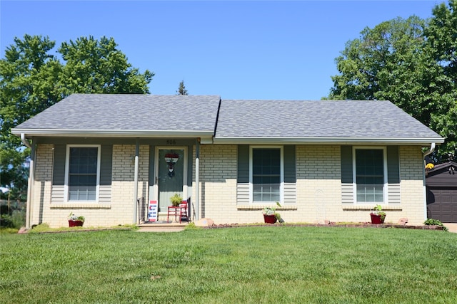506 12th Ave NW, Altoona, IA 50009 - single story home featuring brick siding, a front yard, a shingled roof, and a garage