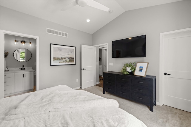 9622 NW 70th Ave, Johnston, IA 50131 - bedroom with vaulted ceiling, light carpet, ensuite bath, and a ceiling fan
