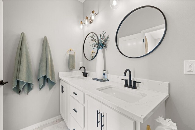 9622 NW 70th Ave, Johnston, IA 50131 - bathroom with double vanity and baseboards