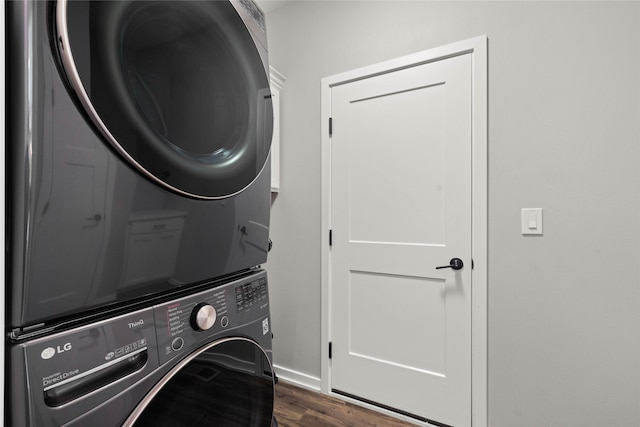 9622 NW 70th Ave, Johnston, IA 50131 - laundry room featuring stacked washer / drying machine and dark wood-style floors