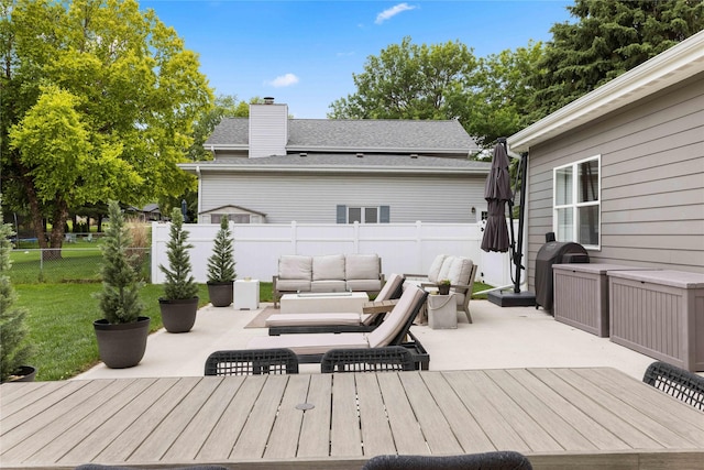 9622 NW 70th Ave, Johnston, IA 50131 - wooden terrace with a patio, a fenced backyard, and outdoor lounge area