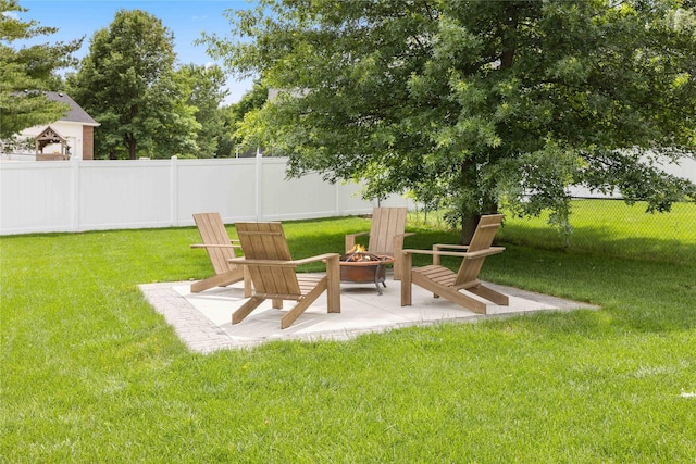 9622 NW 70th Ave, Johnston, IA 50131 - fenced yard featuring a fire pit and a patio