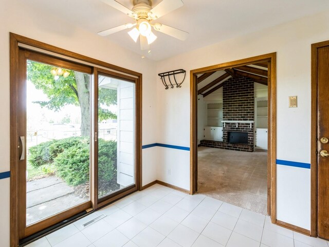 2100 Meadow Brook Dr, West Des Moines, IA 50265 - spare room featuring light colored carpet, lofted ceiling, a ceiling fan, and a fireplace