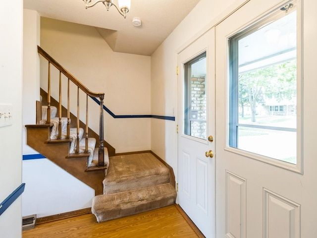 2100 Meadow Brook Dr, West Des Moines, IA 50265 - foyer featuring stairs and wood finished floors