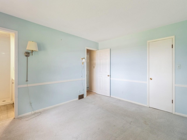 2100 Meadow Brook Dr, West Des Moines, IA 50265 - unfurnished bedroom with carpet and connected bathroom
