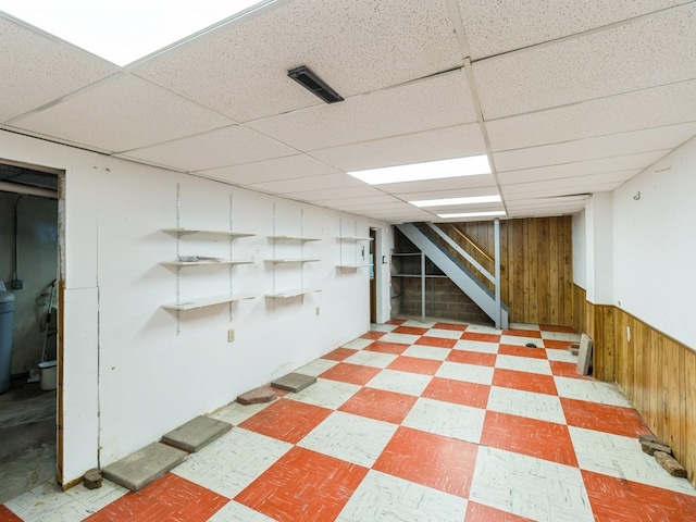 2100 Meadow Brook Dr, West Des Moines, IA 50265 - finished below grade area with light floors, stairs, wood walls, and a paneled ceiling