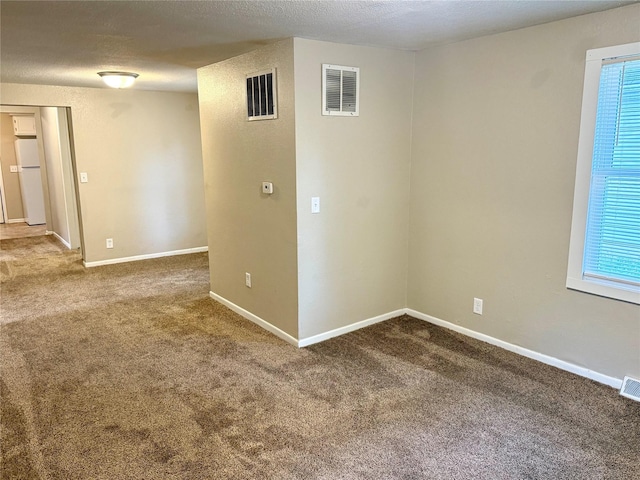 1431 E 19th St, Des Moines, IA 50316 - carpeted spare room featuring baseboards