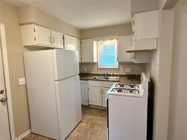 1431 E 19th St, Des Moines, IA 50316 - kitchen with white appliances, under cabinet range hood, dark countertops, and white cabinetry