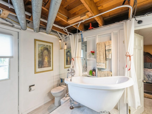 110 E 20th St N, Newton, IA 50208 - bathroom featuring a freestanding bath and toilet