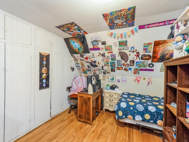 110 E 20th St N, Newton, IA 50208 - bedroom with wood finished floors and wood walls