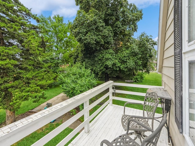 110 E 20th St N, Newton, IA 50208 - wooden terrace with a lawn