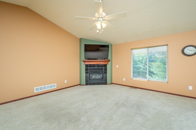 5514 SE 24th St, Des Moines, IA 50320 - unfurnished living room with lofted ceiling, a fireplace, ceiling fan, and carpet flooring