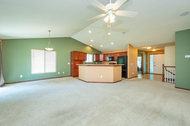5514 SE 24th St, Des Moines, IA 50320 - kitchen featuring black appliances, open floor plan, vaulted ceiling, a center island, and a ceiling fan