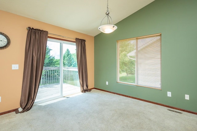 5514 SE 24th St, Des Moines, IA 50320 - carpeted spare room featuring lofted ceiling and baseboards