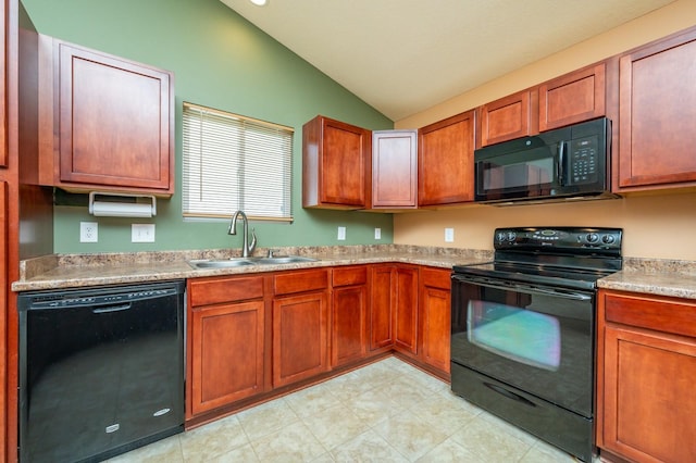5514 SE 24th St, Des Moines, IA 50320 - kitchen with black appliances, vaulted ceiling, light countertops, and brown cabinetry