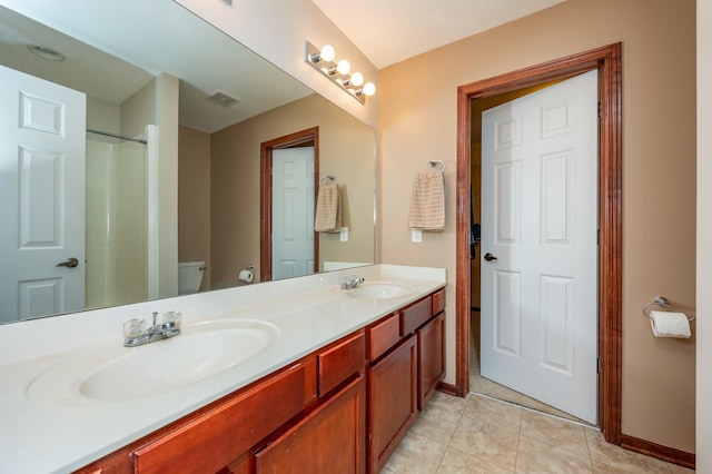 5514 SE 24th St, Des Moines, IA 50320 - bathroom featuring double vanity, tile patterned floors, and a shower