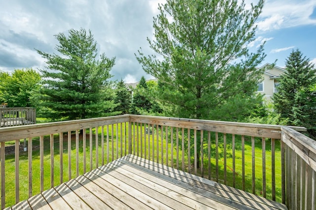 5514 SE 24th St, Des Moines, IA 50320 - wooden deck featuring a lawn